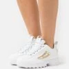 Fila DISRUPTOR M WMN - Sneaker Low - White/gold -Fila Verkaufe 981fc59b48394fe59a6440e37b843aa5